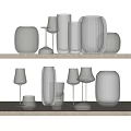 Transparent Wine Bottles And Wine Glasses Neatly Arranged On Two Wooden Shelves