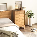 Wooden Chest of Drawers in Bedroom with Bedhead Table Lamp and Green Plant
