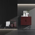 Elegant Modern Entryway Side Cabinet In Burgundy With Decorative Vases Frames And Green Plant