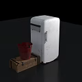 Vintage White Refrigerator Next To Red Bucket On Wooden Crate Displayed On Dark Surface