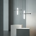 Modern Linear Pendant Lights With Metal Crossbar Over White Display Cubes