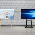 Two TVs With Different Stands Displaying Cartoon Content And Windows Interface