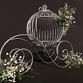 White Decorative Birdcage with Curved Scroll Legs and White Flowers Green Foliage on Dark Background