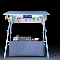 Small Outdoor Kiosk With White Canopy And Colorful Bunting Flags Displaying Items