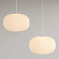 Two Beige Pleated Pendant Lights with Modern Design Hanging Against Gray Background