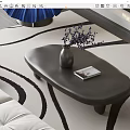 Oval Dark Modern Coffee Table With Purple Flowers Vase And Book On White Sofa Rug