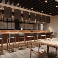 Japanese Restaurant Interior With Wooden Counter Dining Tables Chairs Warm Lighting And Minimalist Decor