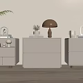 Modern White Bedside Tables With Lamp Books Plants Vases And Decorative Items
