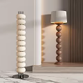 Modern Stylish Floor Lamp With White And Brown Round Stacked Design And Lampshade In Interior