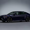 Sleek Blue Sedan Featuring Sporty Alloy Wheels And Aerodynamic Body Design