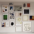 Various Abstract Artworks Hanging On White Wall With Different Styles