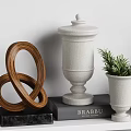 Elegant Decorative Ornament Combination With Photo Frames Sculptures Books Potted Plant And Clock On Shelves