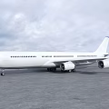White Commercial Passenger Airplane Parked on Tarmac Under Cloudy Sky