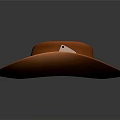 Orange Cowboy Hat With Yellow Band And Decorative Emblem On Gray Background