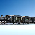 Vintage Black Steam Train with Gold Accents and Carriages on Railway Tracks Against Blue Sky