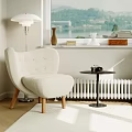 Cozy Beige Armchair With Small Round Side Table Camera Floor Lamp And Window Lake View