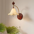 Modern Wall Lamp With Wooden Base Metal Arm White Scalloped Shade And Green Palm Plant