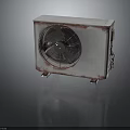 Rusty Old Air Conditioner Outdoor Unit With Metal Casing And Rotating Fan