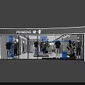 Modern Clothing Store Interior With White Tiled Floor Display Racks And Seating Area