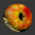 Bitten Ripe Apple Showing Juicy Flesh with Orange Red Skin on Dark Reflective Background
