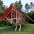 Unique Wooden Observation Deck With Red Canopy In Forest Grass Hill Surroundings