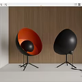 Modern Egg Shaped Table Lamps Orange Black and Black with Tripod Base on Wooden Wall