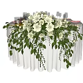 Elegant Round Dining Table With White Tablecloth Stylish Tableware And White Flower Centerpiece Green Foliage