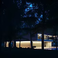 Modern Detached Villa With Modern Design Illuminated Exterior Large Windows And Swimming Pool Surrounded By Trees