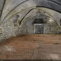 Ancient Stone Room With Vaulted Ceiling Stone Walls And Orange Stained Floor