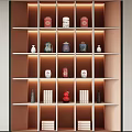 Tea Set Display on Illuminated Multi Tiered Shelves with Teapots Teacups Red Boxes and Books