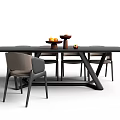 Modern Black Dining Table With Chairs Fruit Platter And Decorative Items