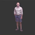 Man Standing with Hands in Pockets Wearing White Shirt and Blue Shorts Against Gray Background