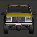 Yellow GMC Pickup Truck With Black Bed Front Grille And Off Road Wheels