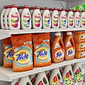 White Retail Display Shelf In Supermarket Stocked With Various Cleaning Products