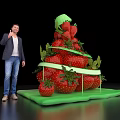 Man Displaying Fresh Strawberry Stacked Tower With Green Base On Black Background