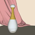Elegant Fragrance Perfume Bottle With Transparent Body And Golden Neck On Pink Fabric Beige Background