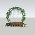 Garden Ornament Featuring Flower Arch Greenery Pink Flowers Hanging Bulbs Wooden Bench And Petals