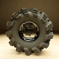 Off Road Tire With Deep Tread Pattern And Shiny Metallic Alloy Wheel Design