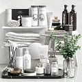 Stylish Bathroom Accessories With Folded Towels Aromatic Bottles And Green Plant On Shelves