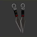 Two Black And Silver Textured Daggers With Sharp Blades And Blue Red Accent Handles