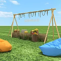Outdoor Grass Area With Sunday Wooden Swing Frame Orange Blue Bean Bags And Fruit Baskets