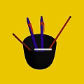 Purple Pens and Red Pencils in Black Cup with White Tips on Dark Desk