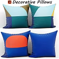 Colorful Geometric Pillows With Abstract Blue Green Orange And Yellow Patterns