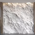White Rough Textured Background Wall With Wooden Panels And Framed Artwork