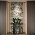 Modern Entryway Interior Design With Marble Textured Wall And Green Decorative Sculpture