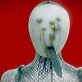 Mysterious Game Movie Character With White Mask Gold Spiral Eyes And Mesh Clothing On Red Background