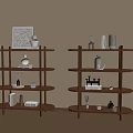Wooden Multi Tiered Shelves With Decorative Vases Books And Ornaments In Warm Sunlit Room