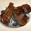 Roasted Chicken Legs On Floral Pattern Plate With Juicy Golden Brown Texture