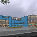 Modern Blue Glass Facade Shopping Complex With 2023 Design And Open Plaza Area