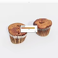 Freshly Baked Muffins With Brown Surface And Speckled Texture In Paper Liners On White Background